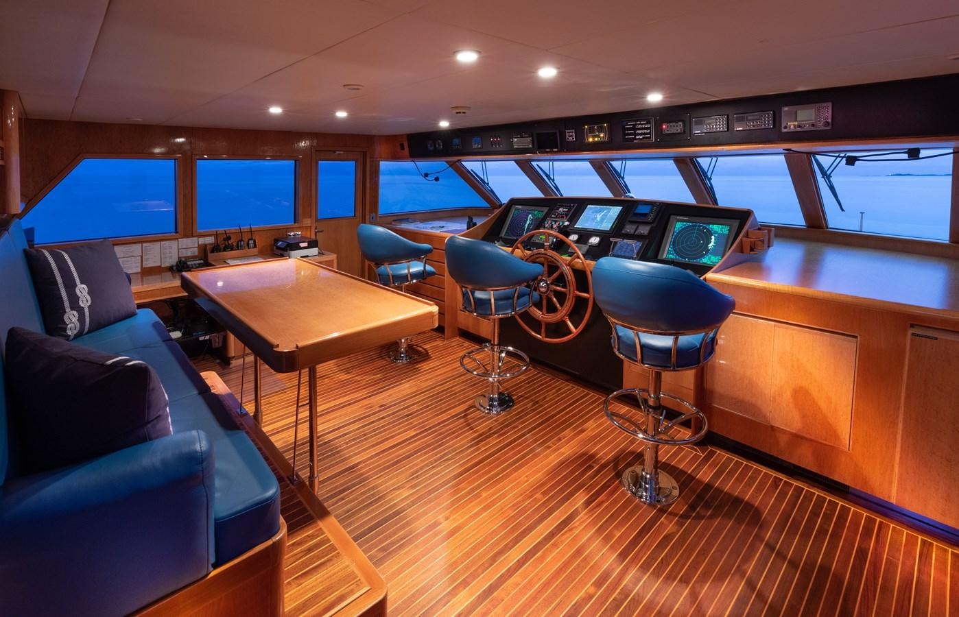 a room with a desk and chairs aboard RENA Yacht for Sale