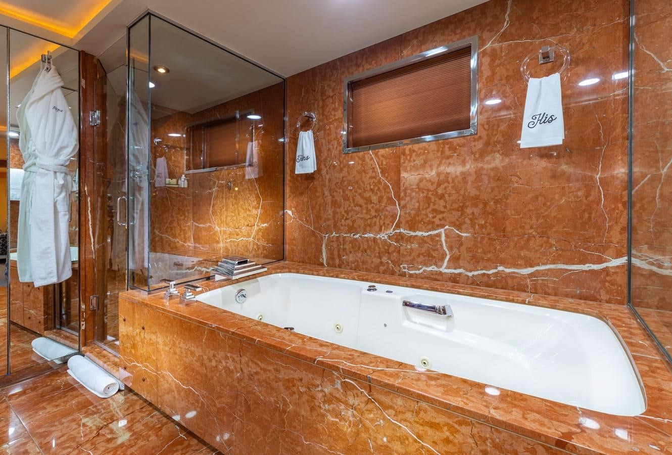 a bathroom with a bathtub aboard RENA Yacht for Sale