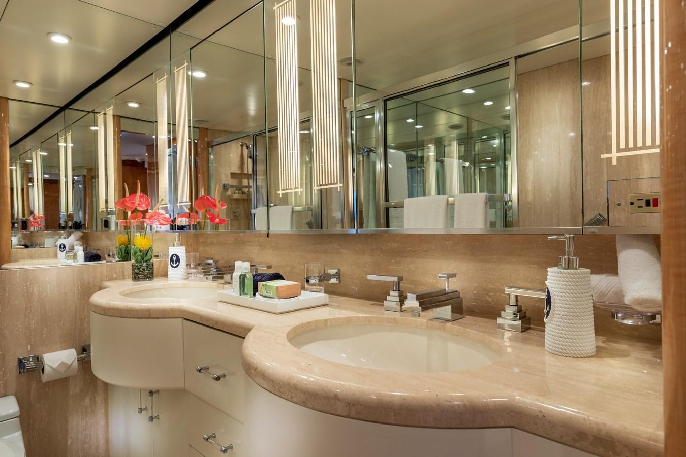 a bathroom with a large mirror aboard RENA Yacht for Sale