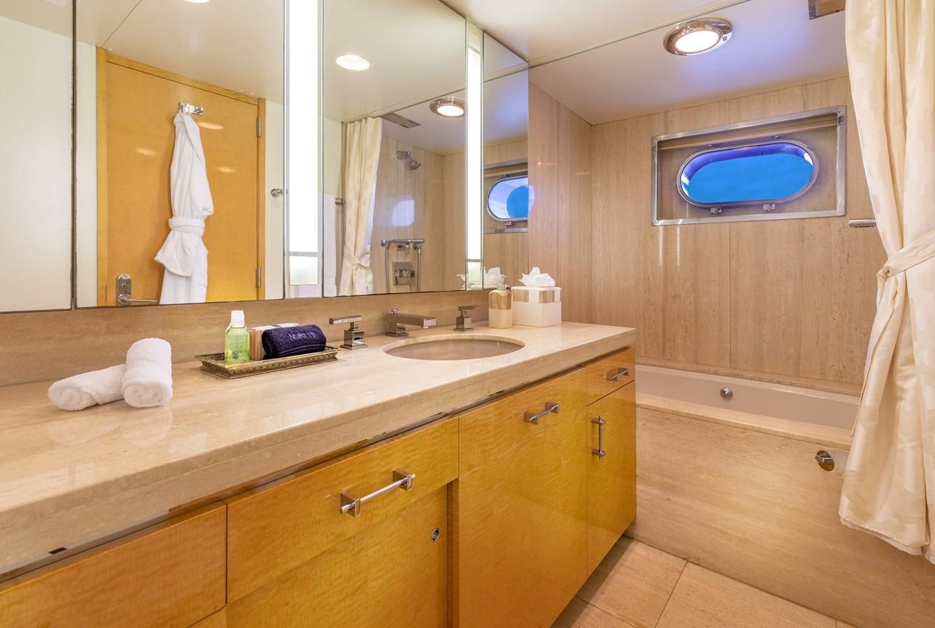 a bathroom with a large mirror aboard RENA Yacht for Sale