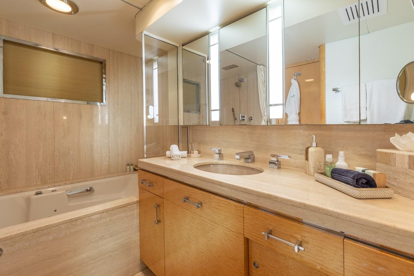 a bathroom with a large mirror aboard RENA Yacht for Sale