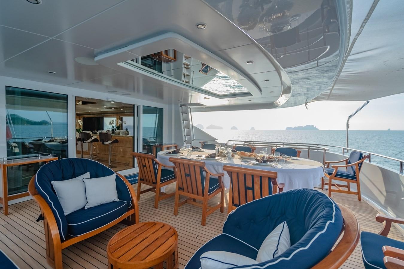 a large dining room with a large deck and a large ship aboard LADY AZUL Yacht for Sale