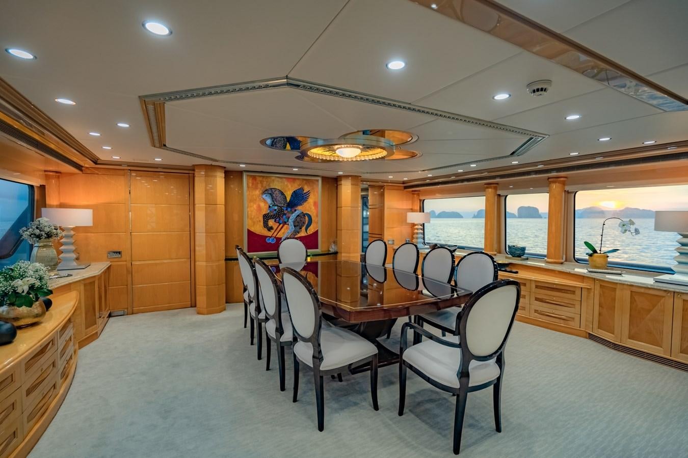 a large kitchen with a dining table aboard LADY AZUL Yacht for Sale