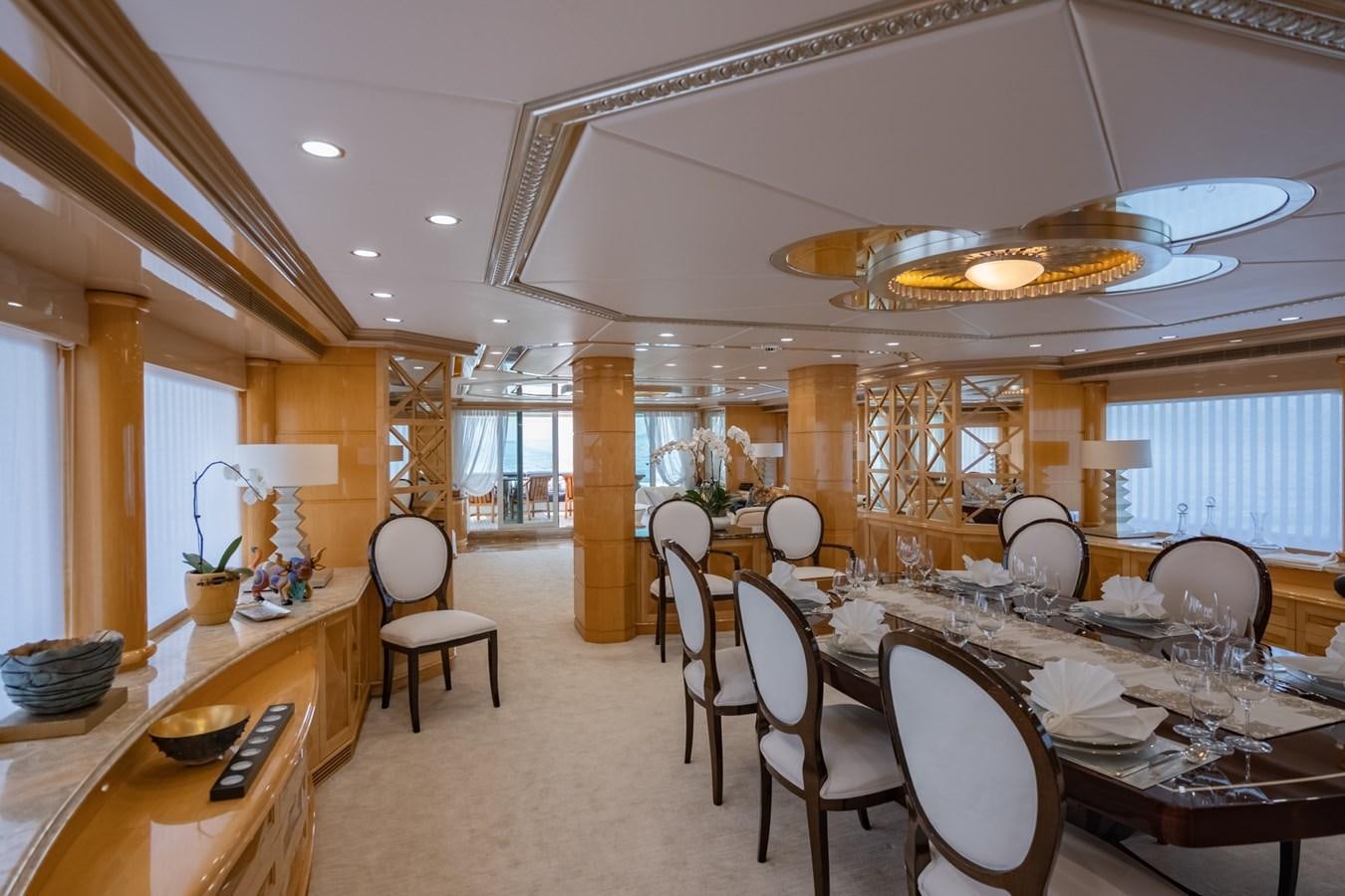 a large dining room with tables and chairs aboard LADY AZUL Yacht for Sale