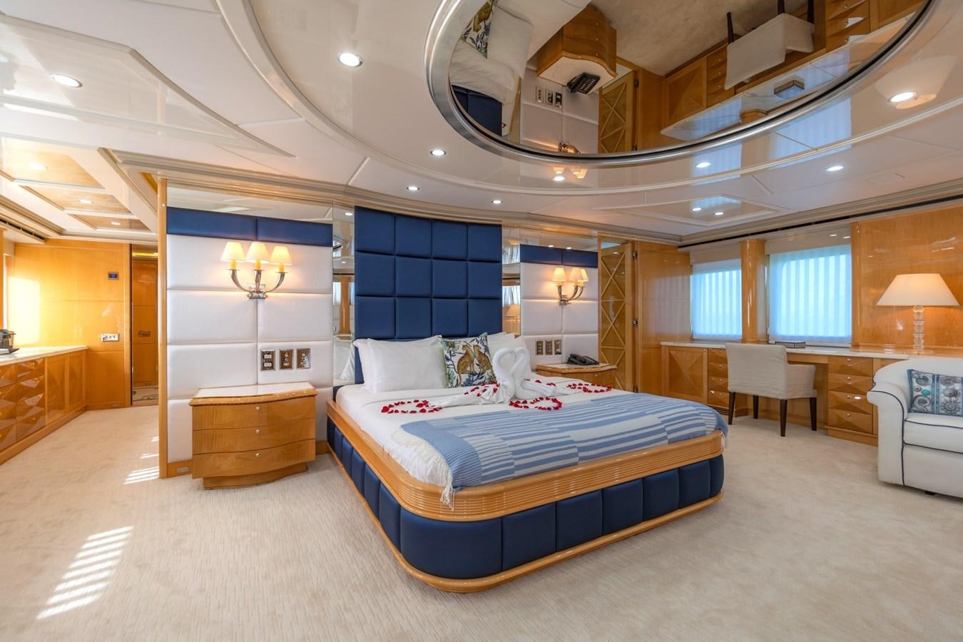 a large bedroom with a large bed aboard LADY AZUL Yacht for Sale