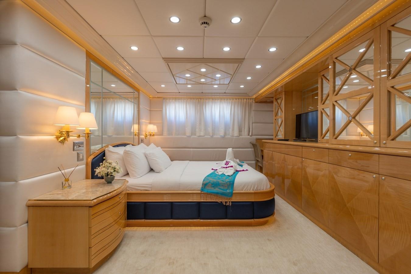 a large bedroom with a large bed aboard LADY AZUL Yacht for Sale