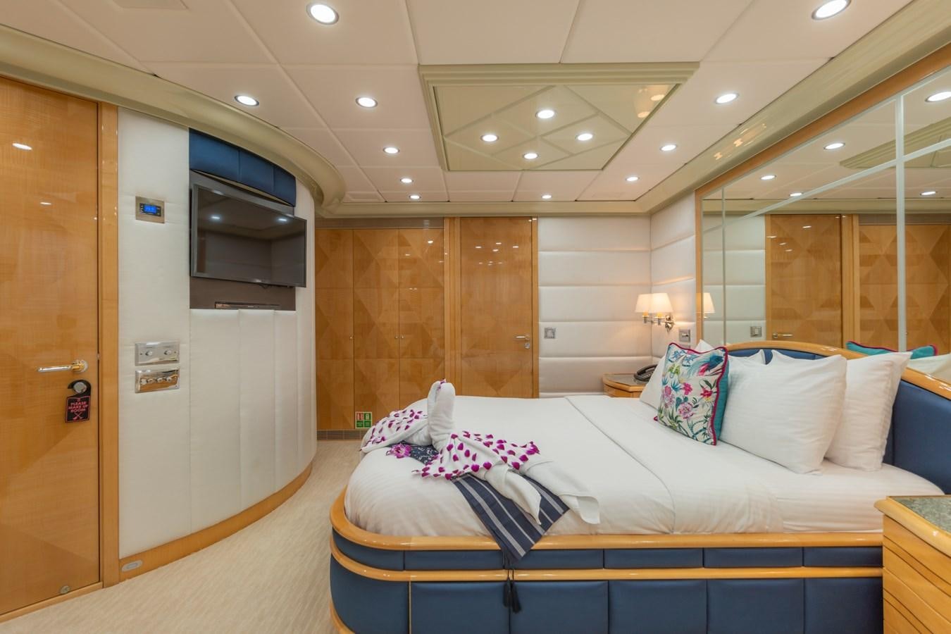 a room with a bed and a door aboard LADY AZUL Yacht for Sale