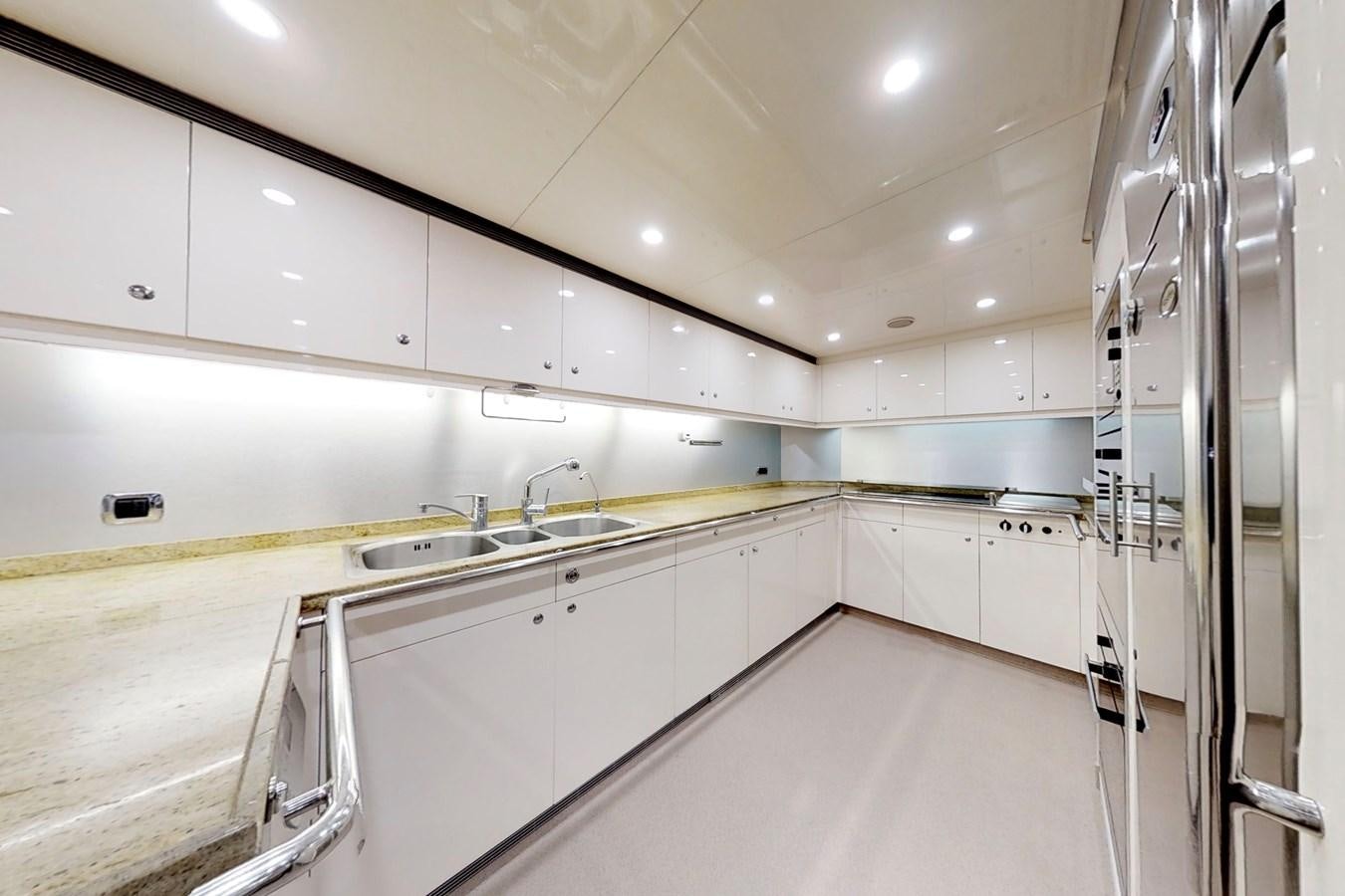 a kitchen with white cabinets aboard LADY AZUL Yacht for Sale
