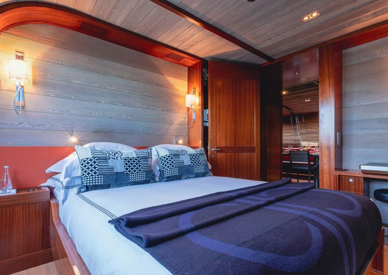 a bed with a blue sheet aboard ROSEHEARTY Yacht for Sale