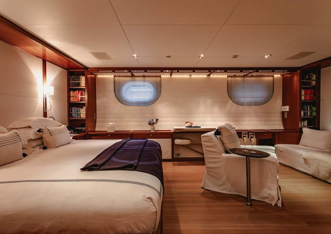 a room with a bed and a table aboard ROSEHEARTY Yacht for Sale