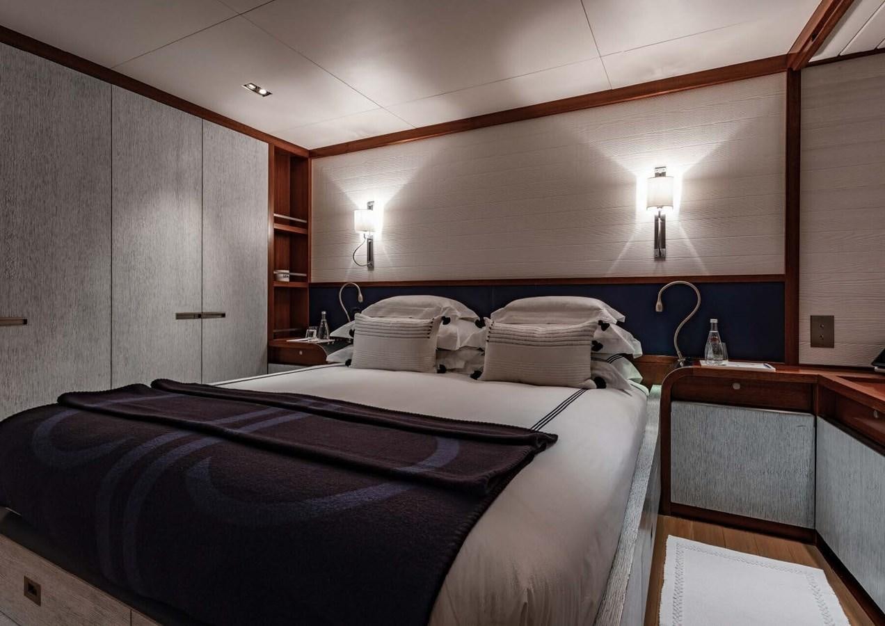 a room with a bed and a desk aboard ROSEHEARTY Yacht for Sale