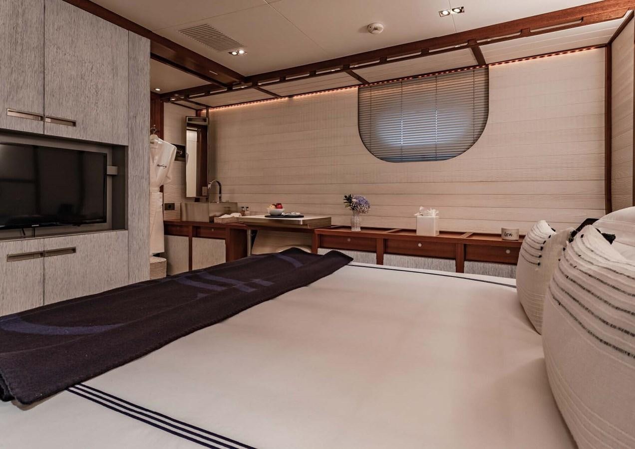 a room with a bed and a television aboard ROSEHEARTY Yacht for Sale