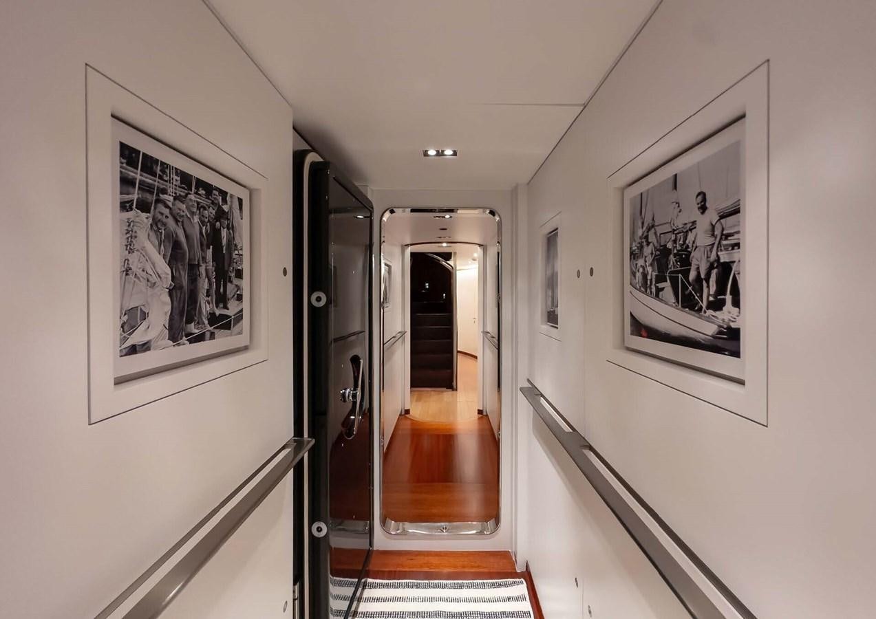 a hallway with art on the wall aboard ROSEHEARTY Yacht for Sale