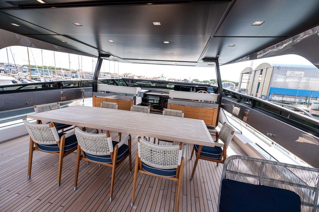 a table and chairs on a boat aboard VISSOTTA Yacht for Sale