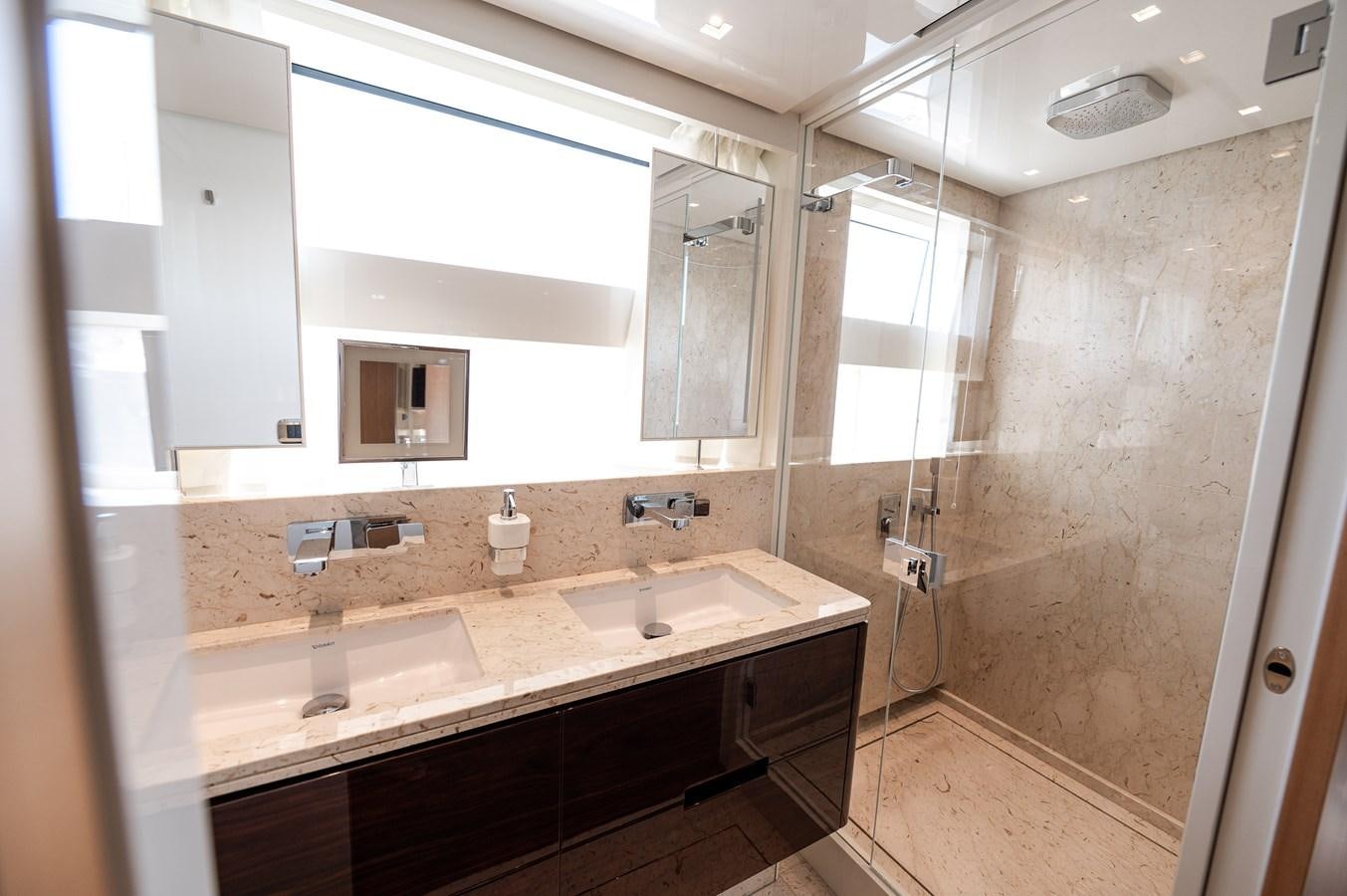 a bathroom with a large mirror aboard VISSOTTA Yacht for Sale