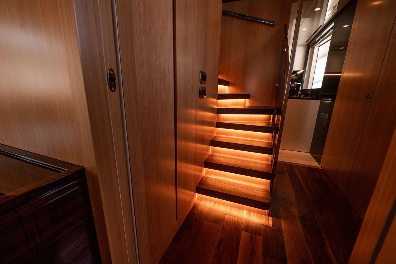 a wooden hallway with a wood door aboard VISSOTTA Yacht for Sale