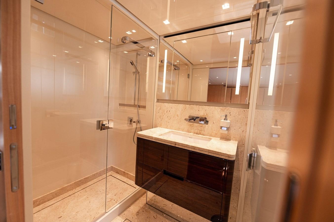 a bathroom with a large mirror aboard VISSOTTA Yacht for Sale