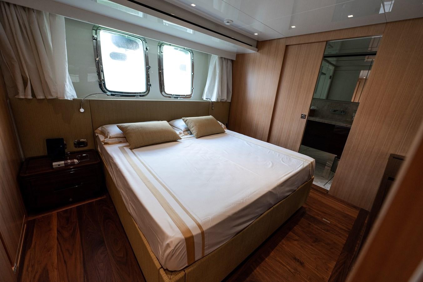 a bed in a room aboard VISSOTTA Yacht for Sale