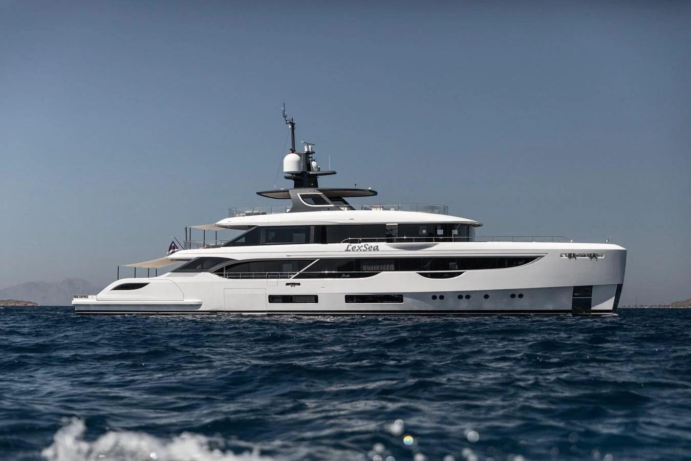 a white yacht in the water aboard LEXSEA Yacht for Sale