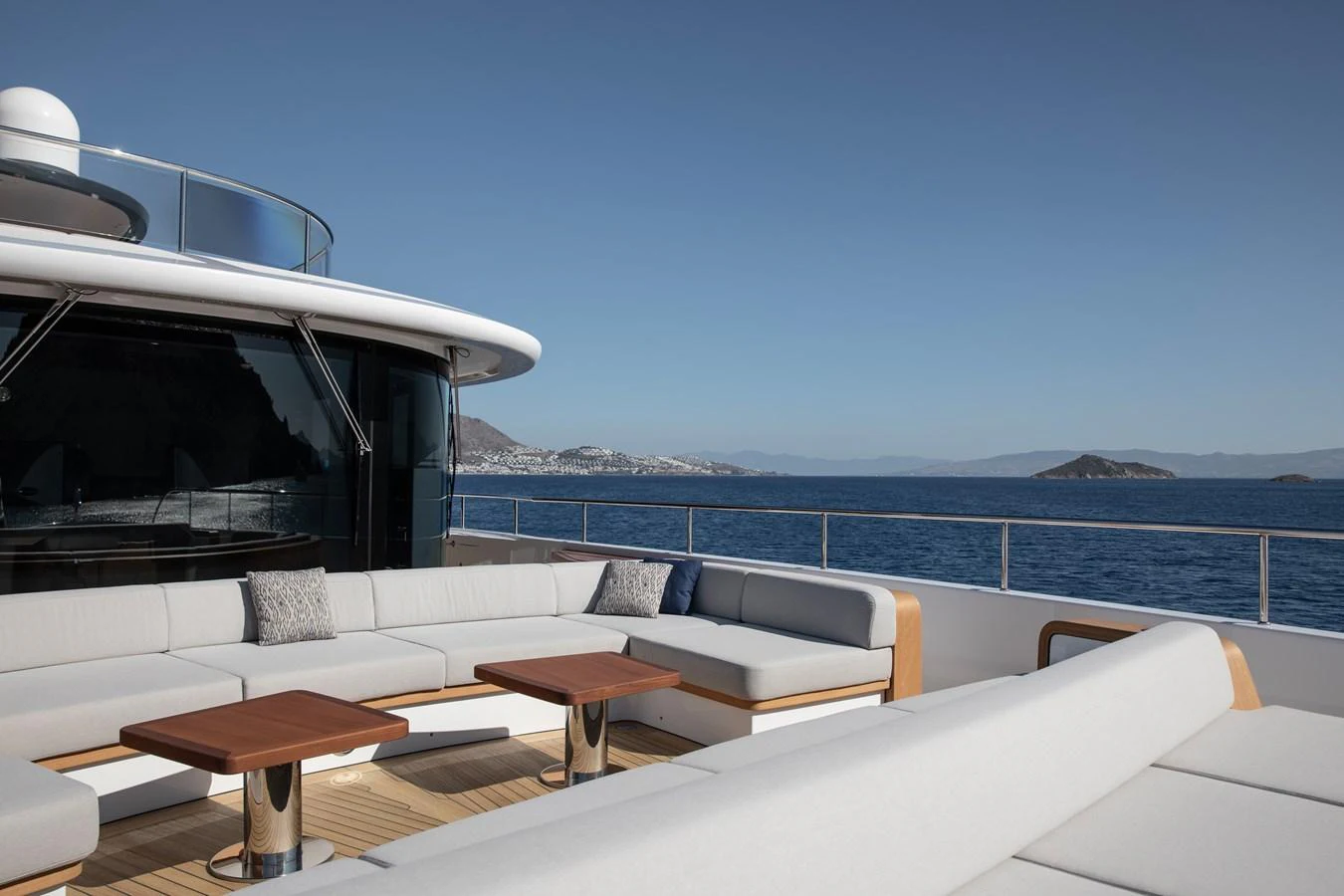 a room with a table and chairs on it aboard LEXSEA Yacht for Sale