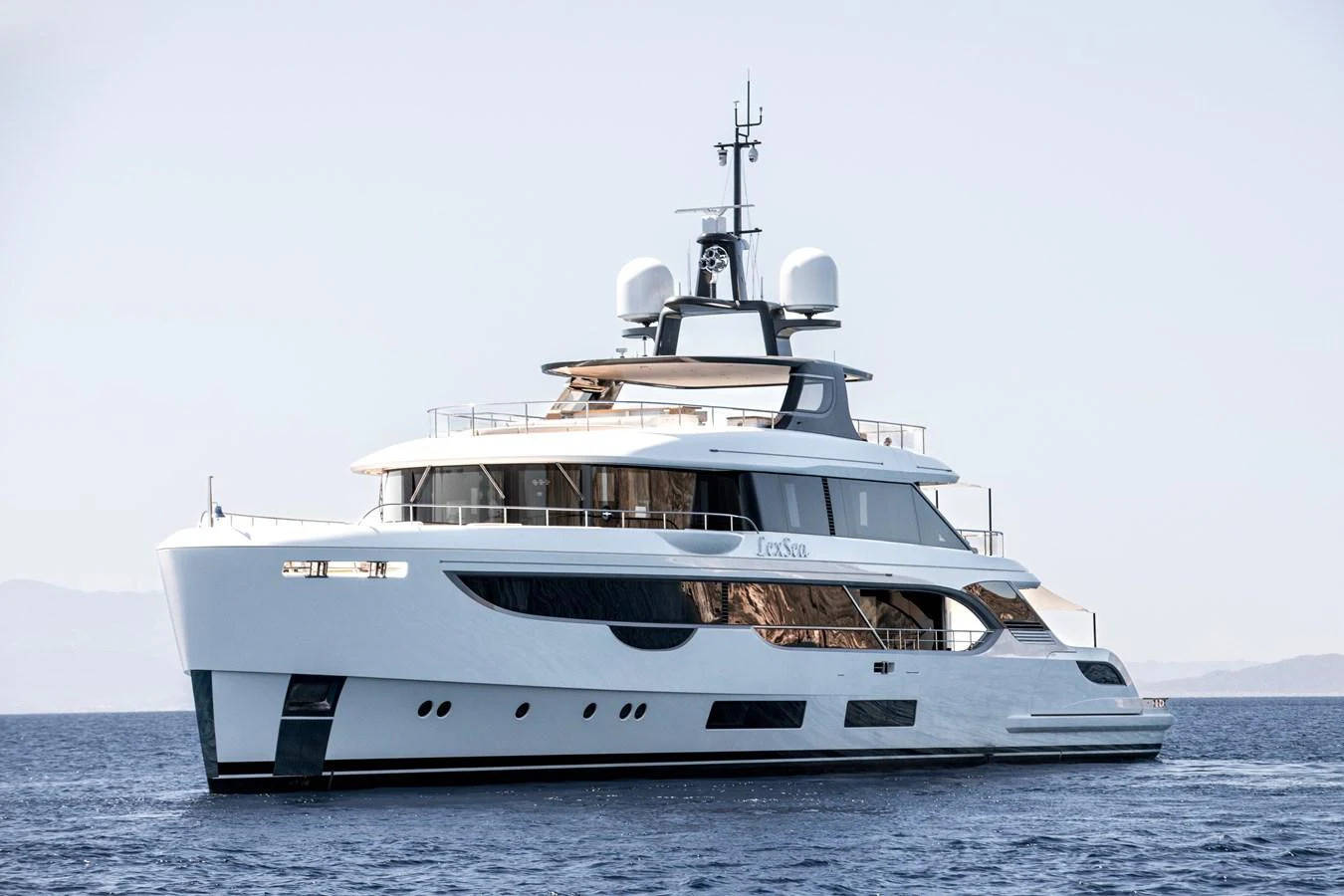 a white yacht in the water aboard LEXSEA Yacht for Sale
