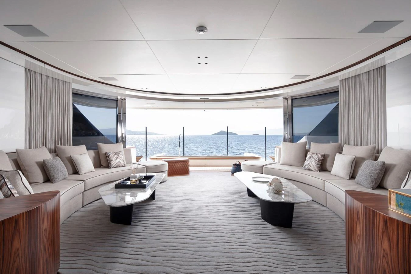 a living room with a large ocean aboard LEXSEA Yacht for Sale