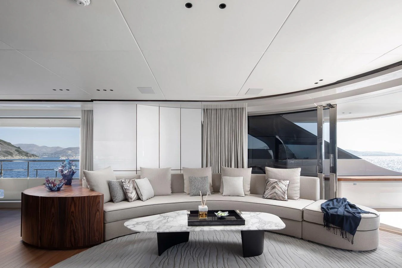 a living room with a large window aboard LEXSEA Yacht for Sale