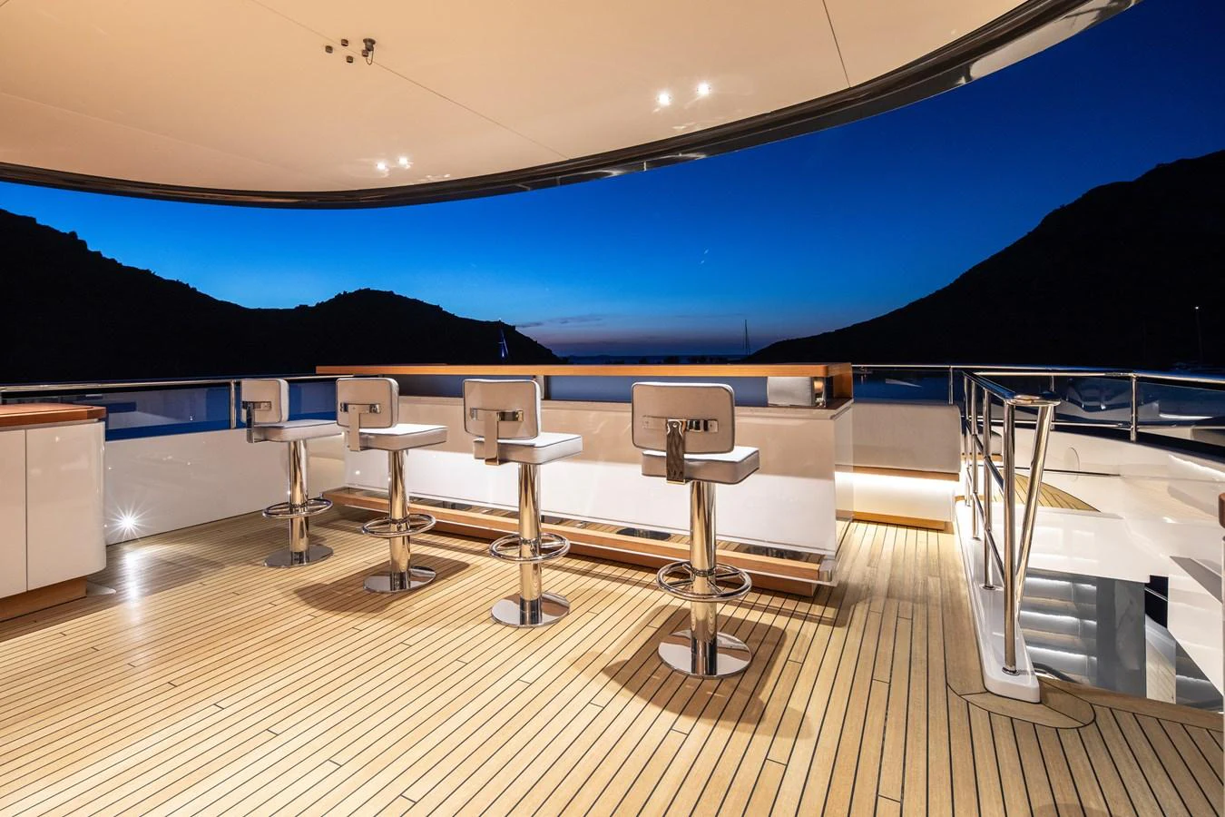 a room with tables and chairs aboard LEXSEA Yacht for Sale