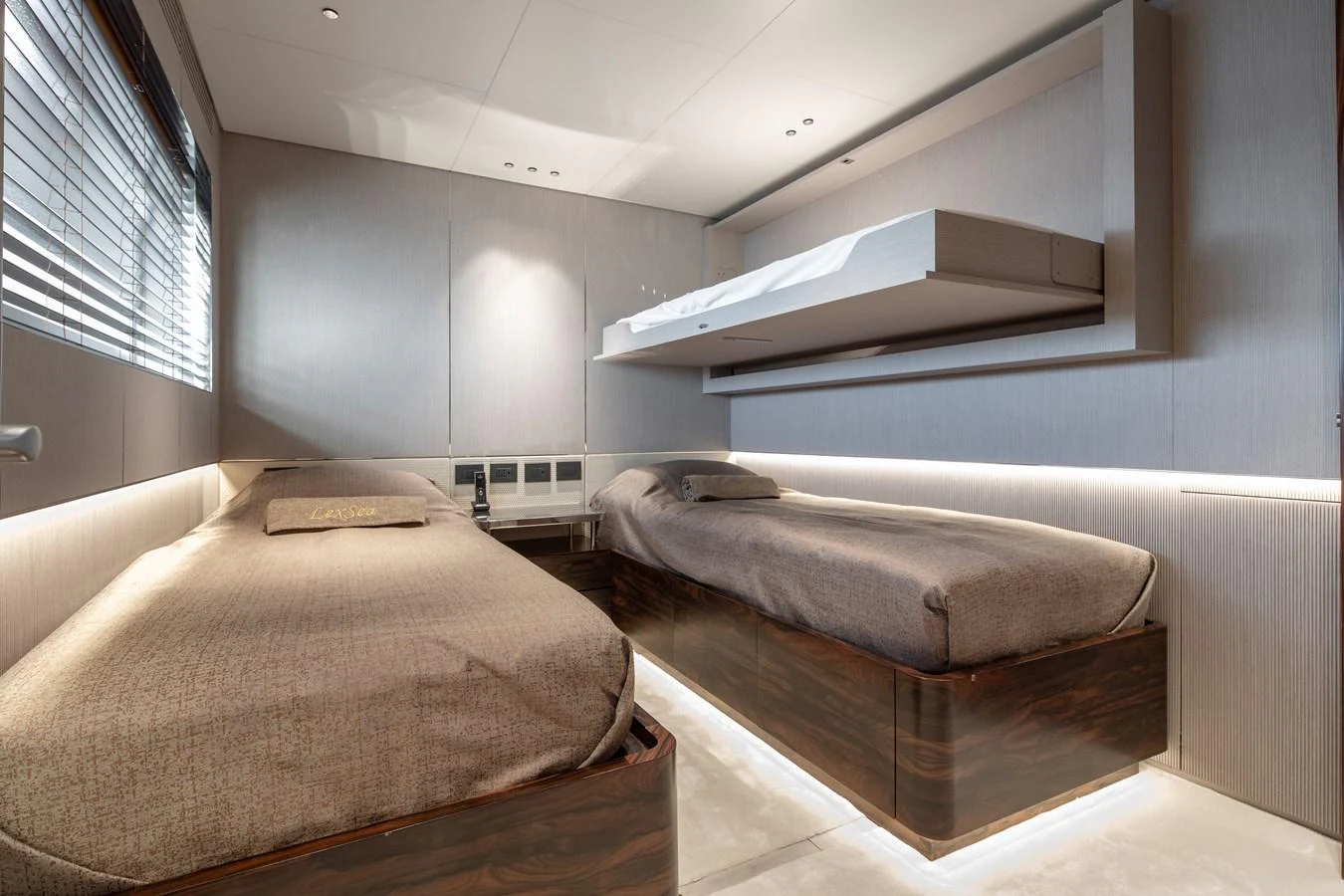 a room with two beds aboard LEXSEA Yacht for Sale