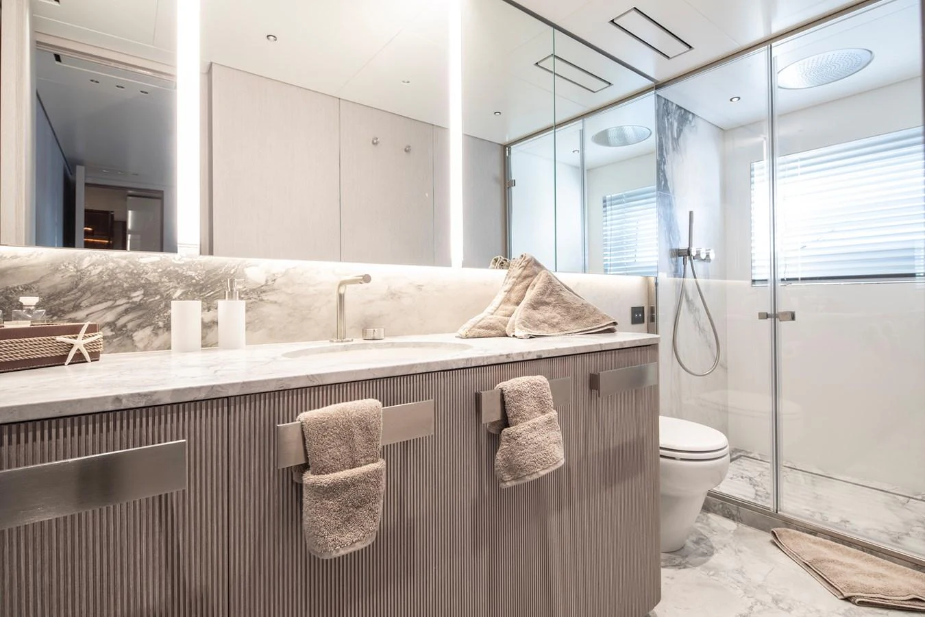 a bathroom with a large bathtub aboard LEXSEA Yacht for Sale