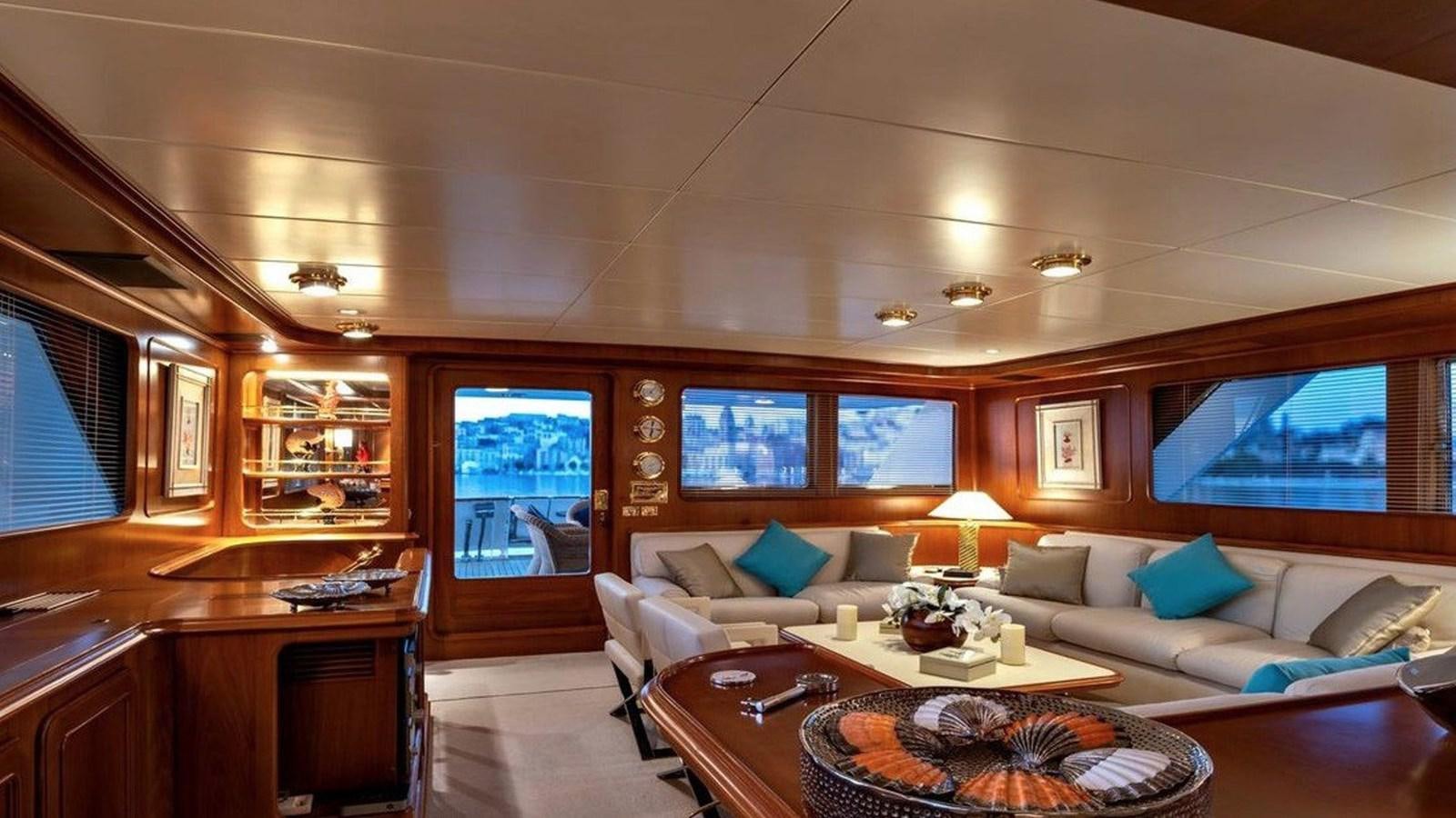 a living room with a couch and a table aboard NIGHTFLOWER Yacht for Sale