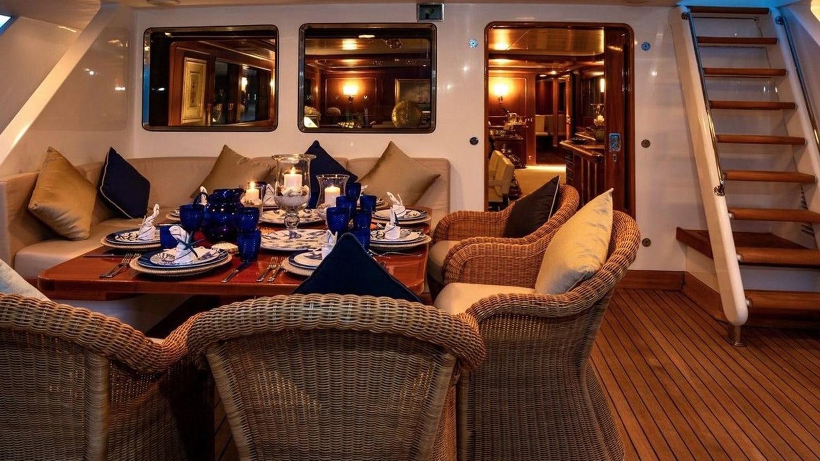 a living room with a staircase aboard NIGHTFLOWER Yacht for Sale