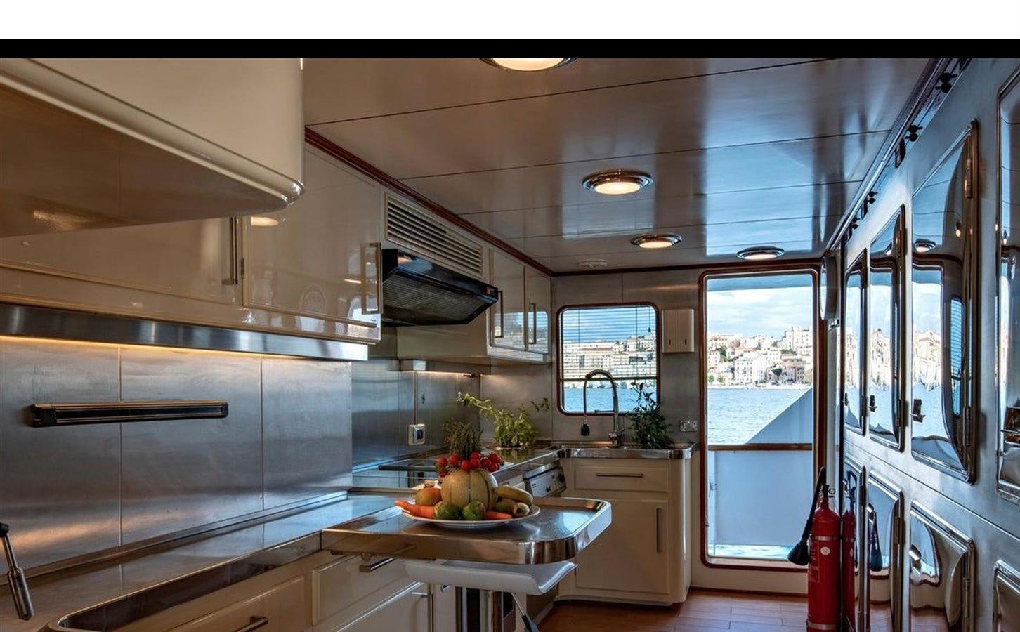 a kitchen with a large island aboard NIGHTFLOWER Yacht for Sale
