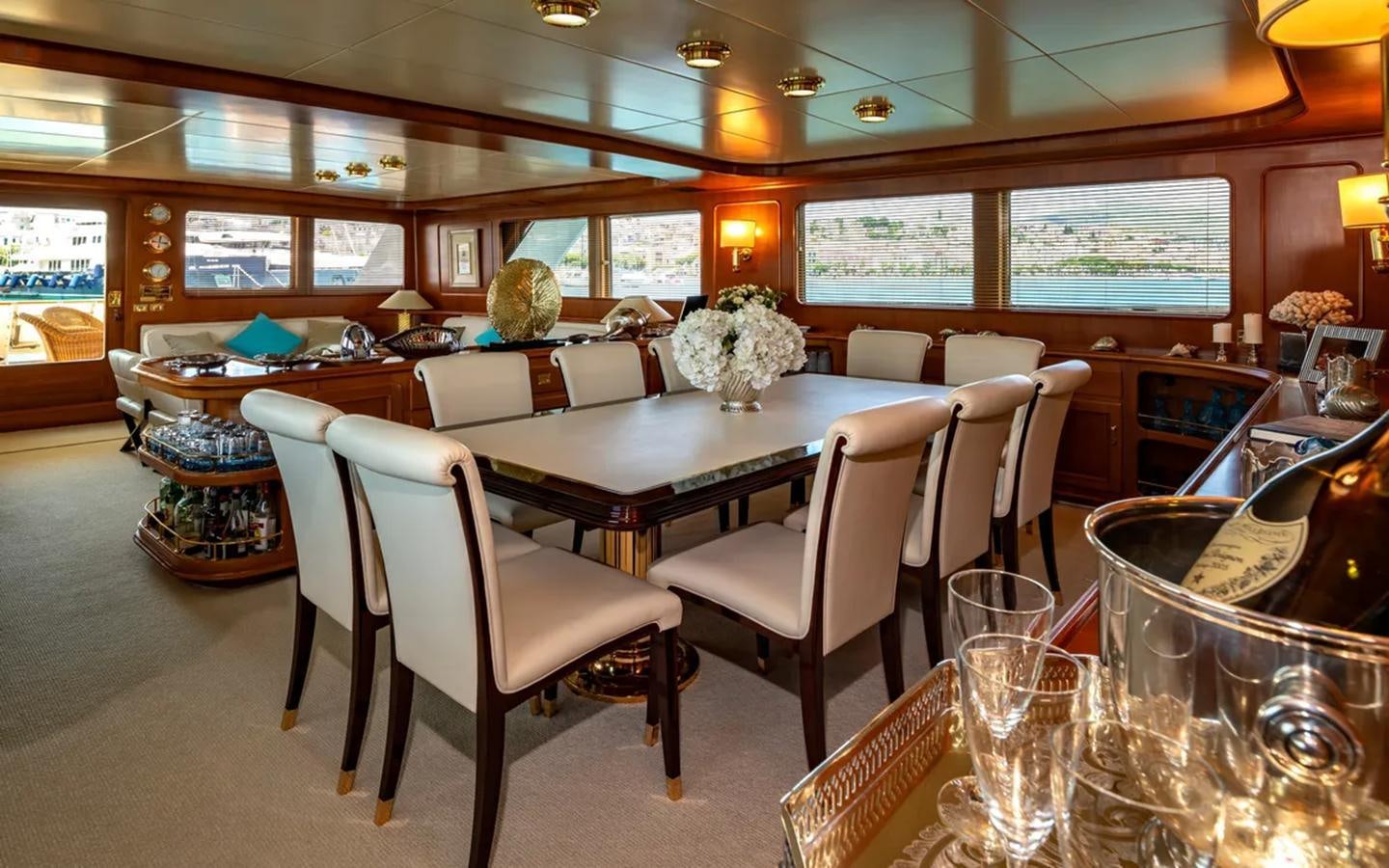 a restaurant with tables and chairs aboard NIGHTFLOWER Yacht for Sale