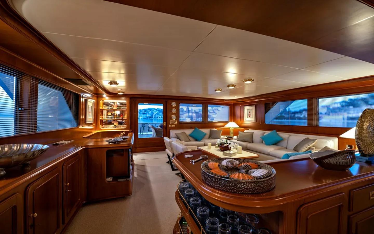 a large living room with a large kitchen and dining area aboard NIGHTFLOWER Yacht for Sale