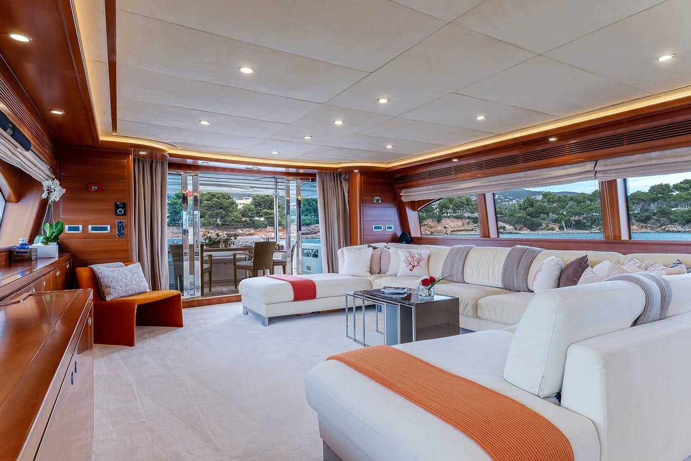a room with white couches and a table and a window aboard MALEN Yacht for Sale