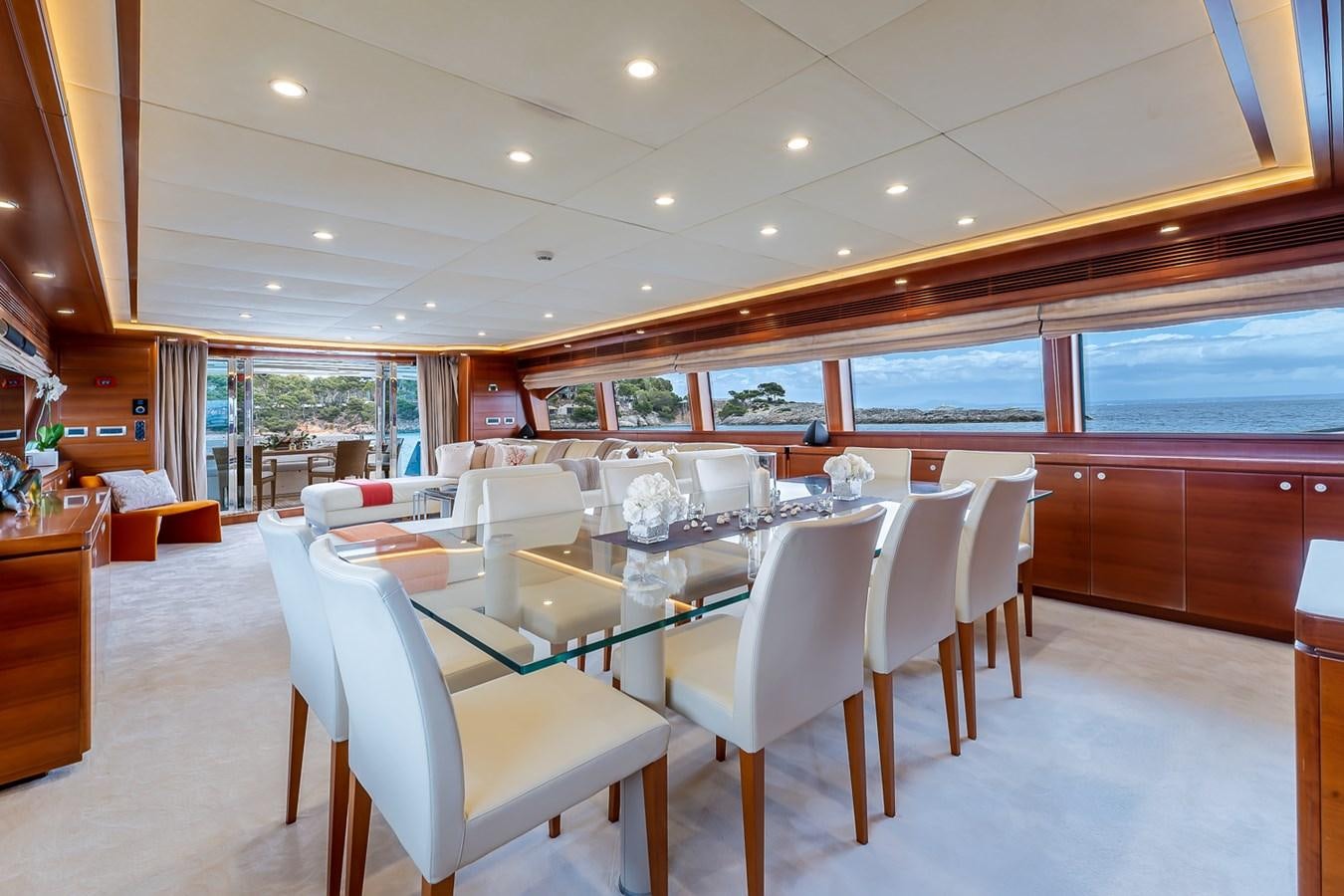 a large room with tables and chairs aboard MALEN Yacht for Sale