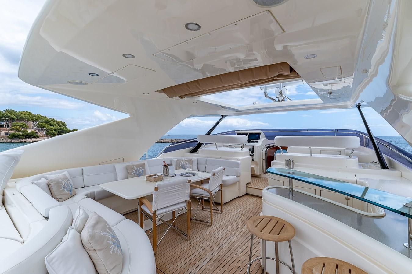 a room with a boat and tables aboard MALEN Yacht for Sale