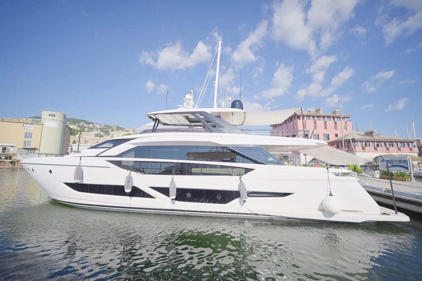 a white yacht in a harbor aboard ASMARA Yacht for Sale