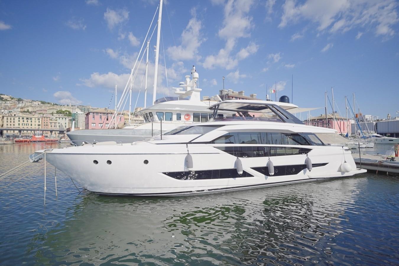 a white yacht docked at a pier aboard ASMARA Yacht for Sale