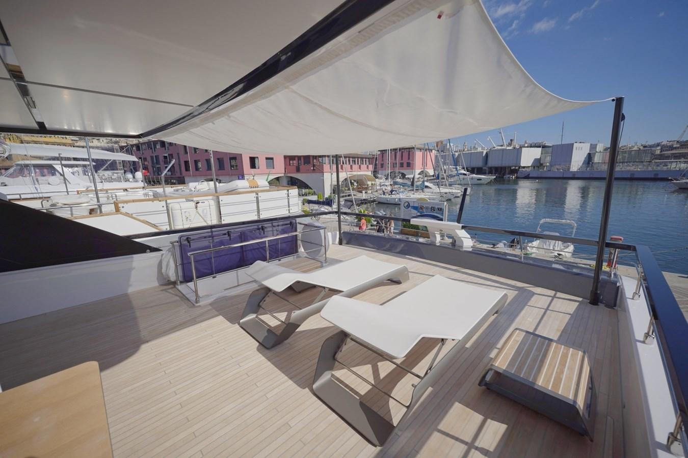 a deck with a view of a boat and a dock aboard ASMARA Yacht for Sale