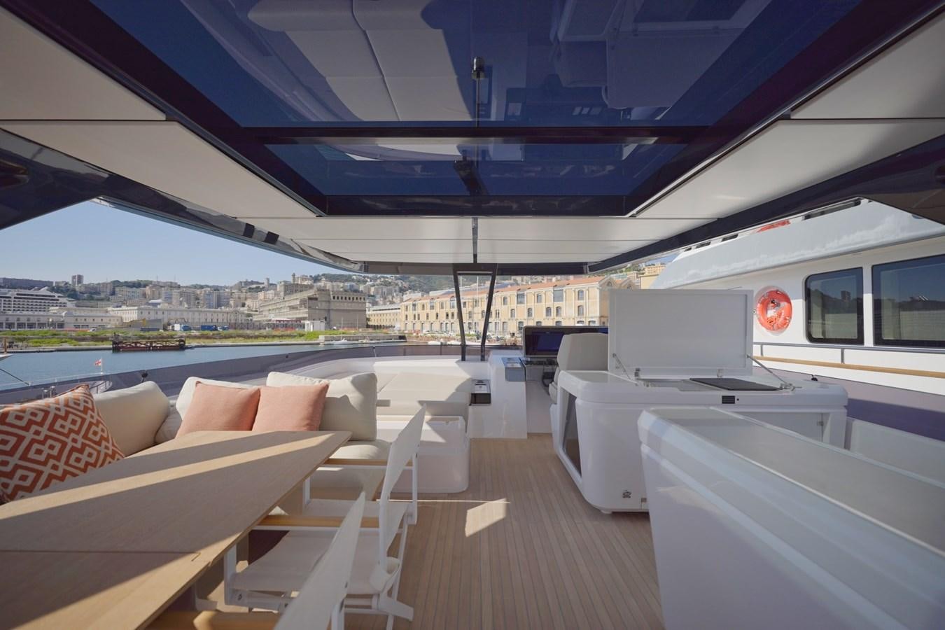 a boat deck with a view of a city and water aboard ASMARA Yacht for Sale