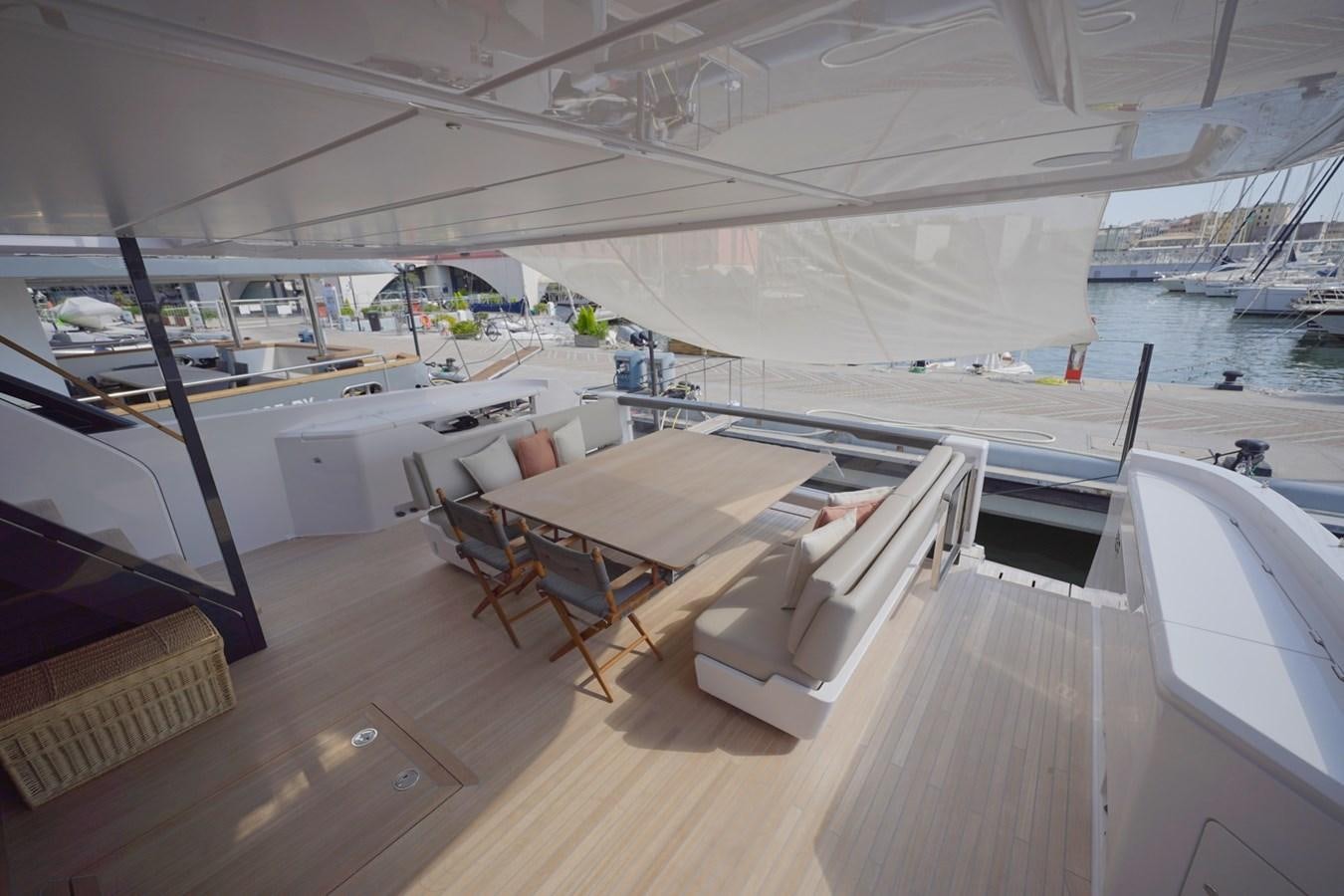 a room with a deck and a view of the water aboard ASMARA Yacht for Sale