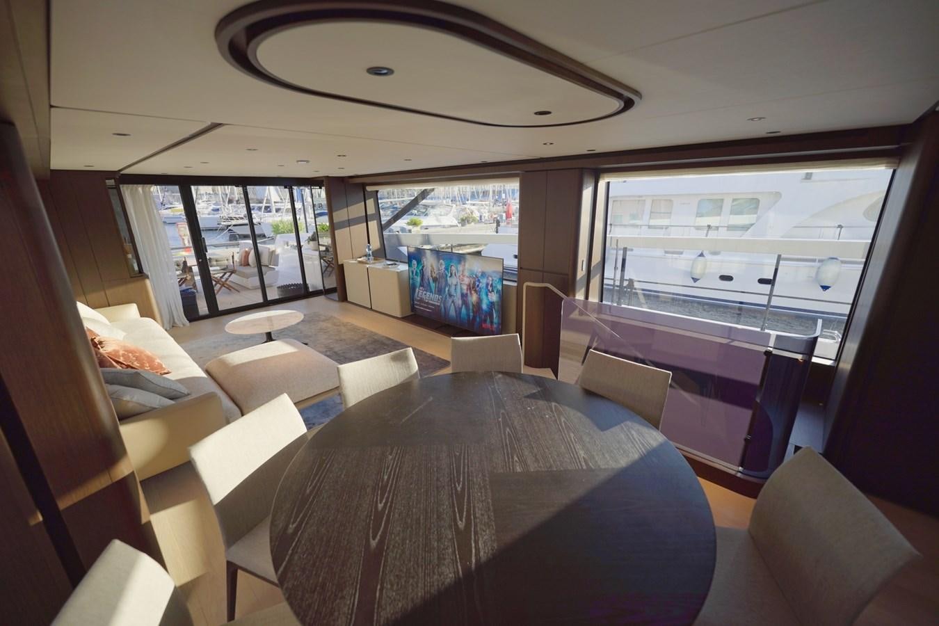 inside of a vehicle with a large window and a table with chairs aboard ASMARA Yacht for Sale