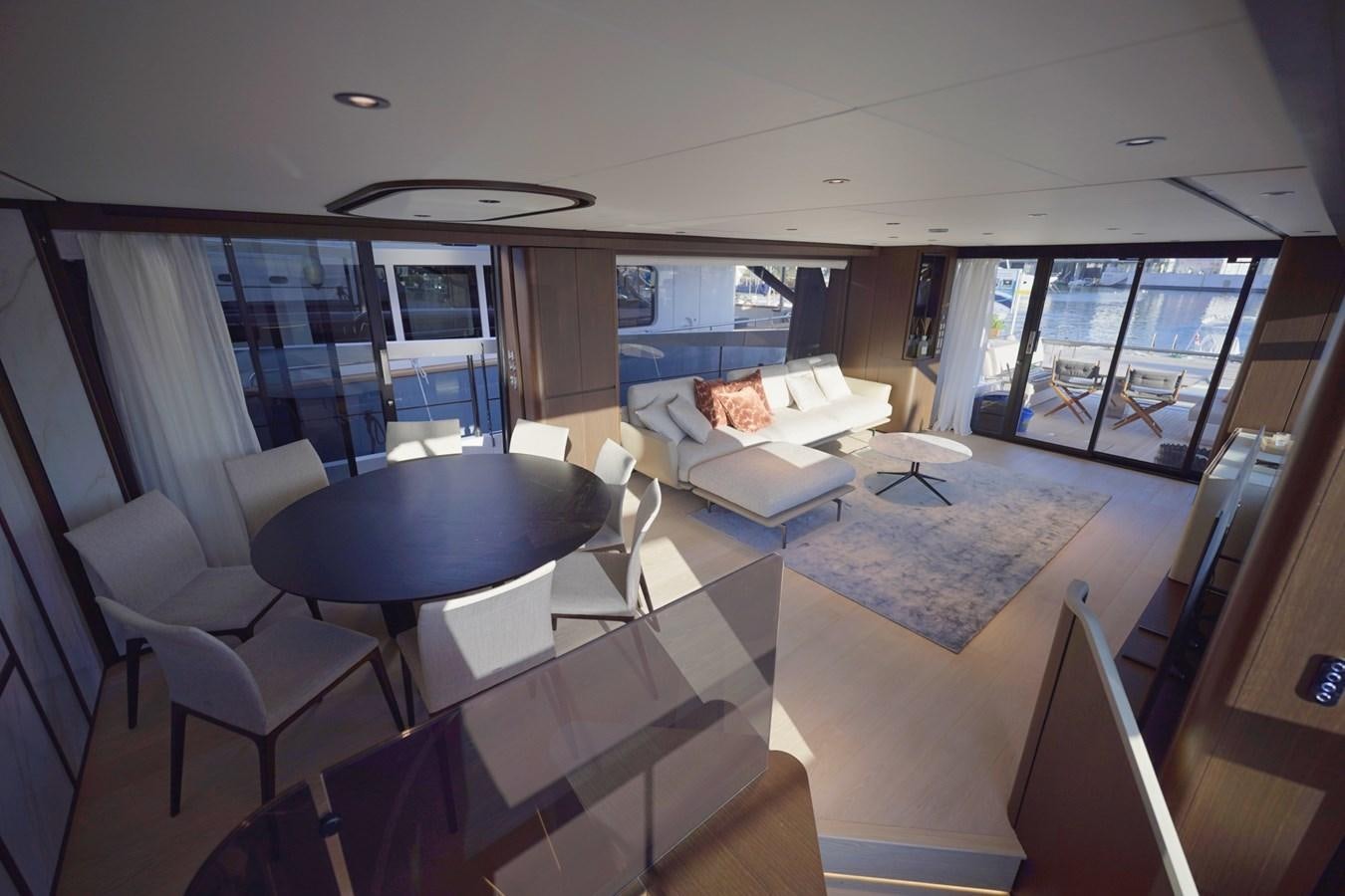 a room with a table chairs and a window aboard ASMARA Yacht for Sale
