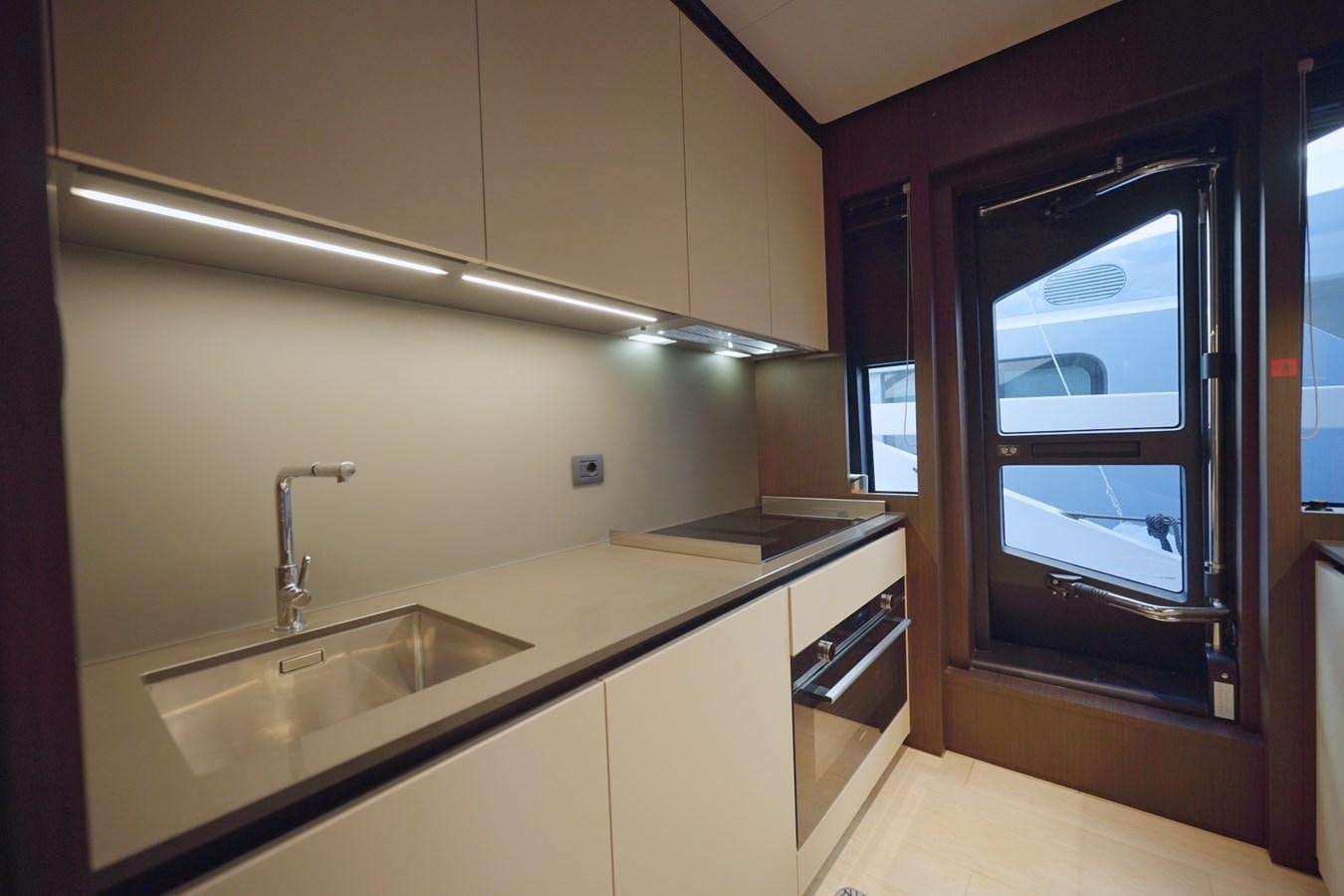 a kitchen with a sink and a window aboard ASMARA Yacht for Sale