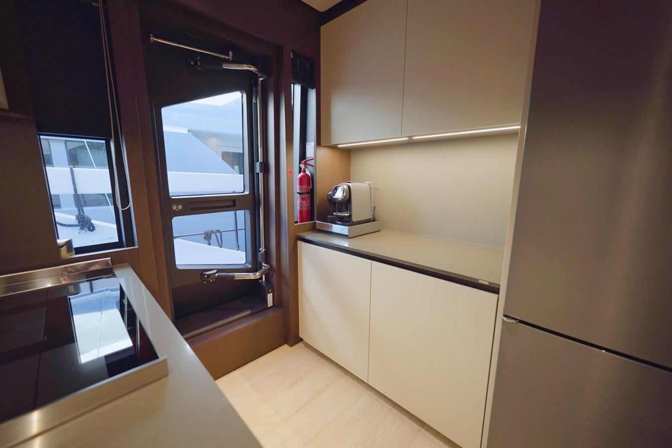 a kitchen with a microwave oven aboard ASMARA Yacht for Sale