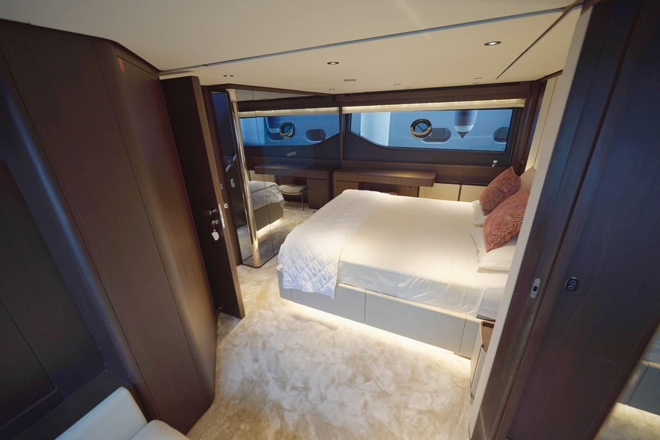 a room with a bed and a television aboard ASMARA Yacht for Sale