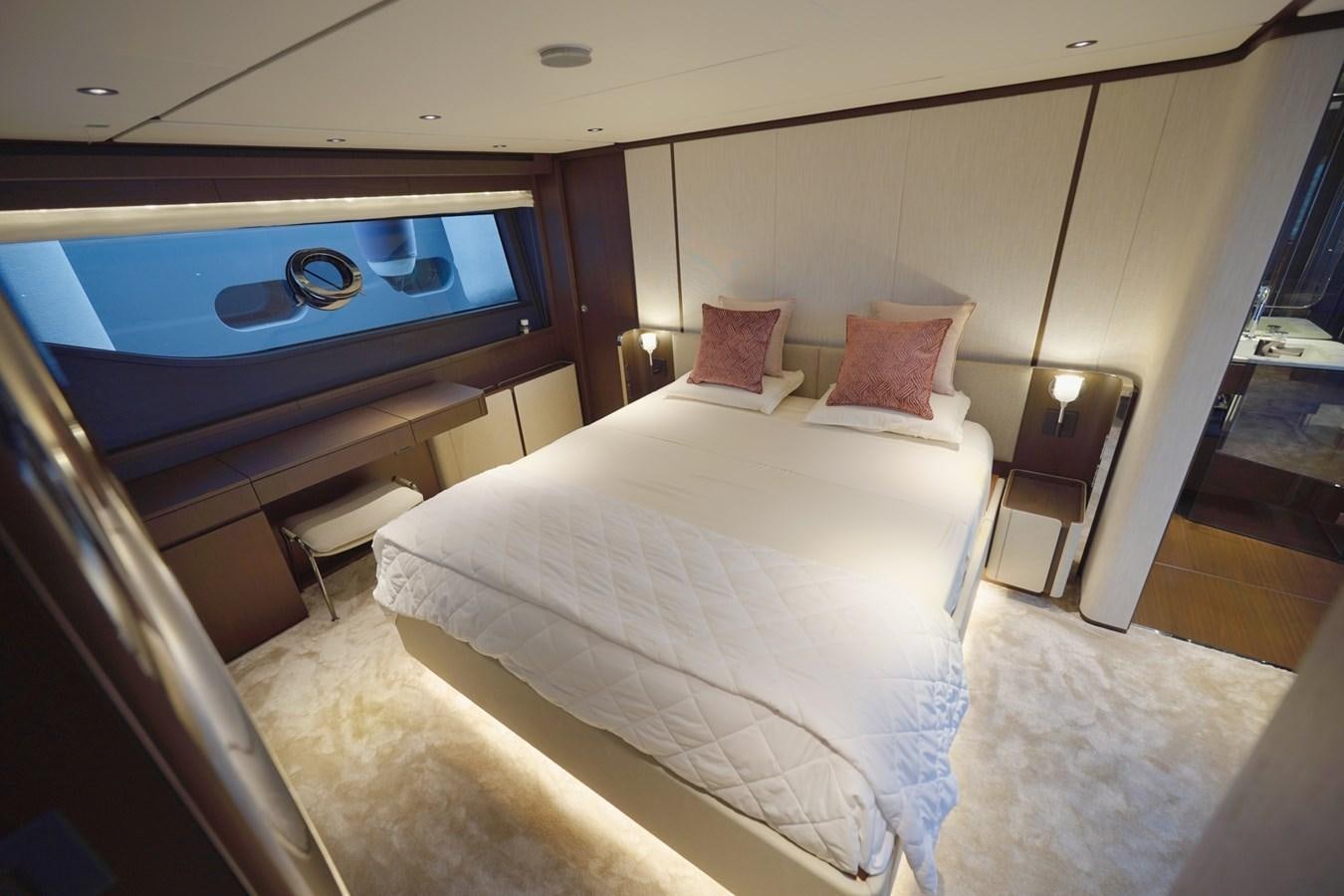a hotel room with a bed and a tv aboard ASMARA Yacht for Sale