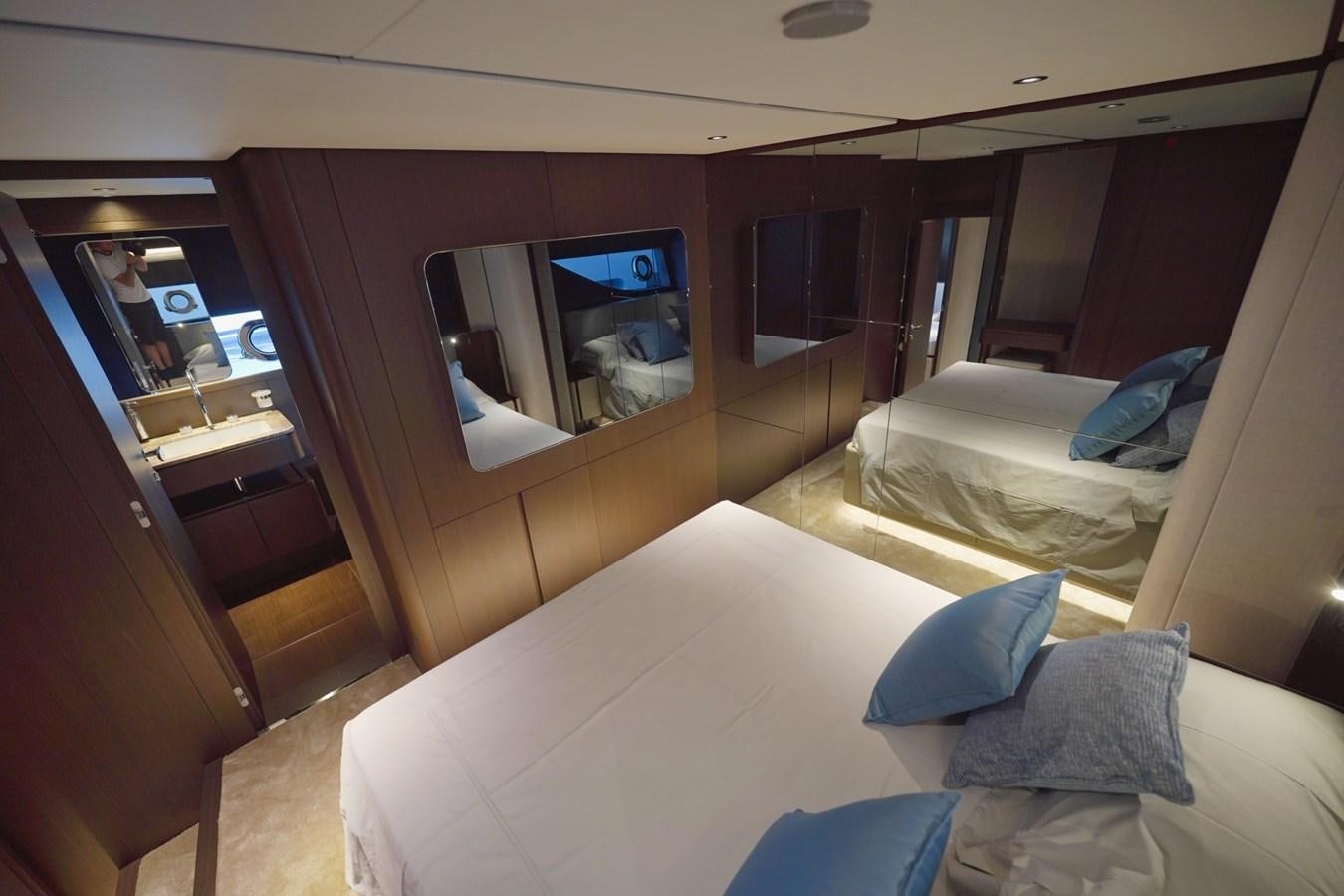 a room with a bed and a television aboard ASMARA Yacht for Sale